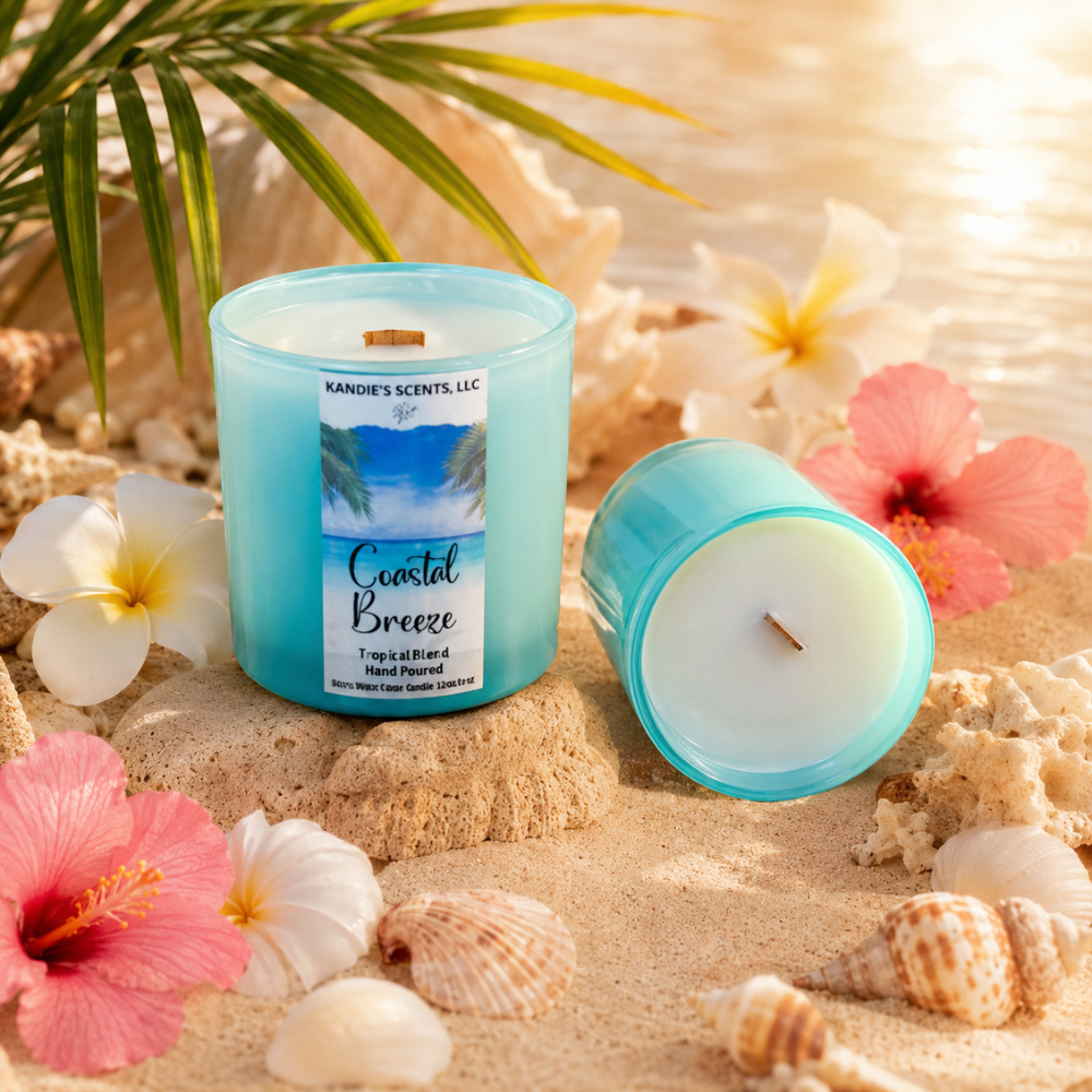 Coastal Breeze candle with sand, flowers, and shells in the background