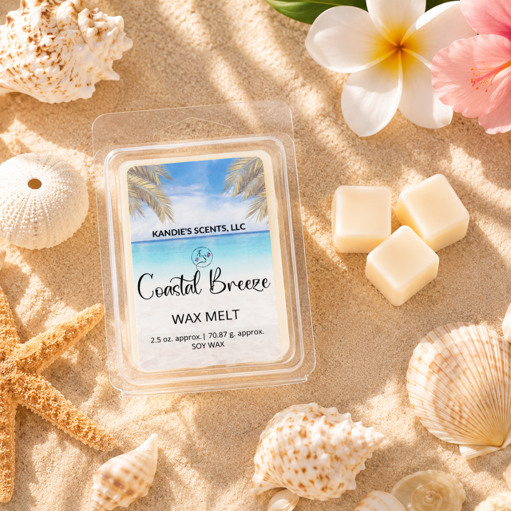 Coastal Breeze wax melt packaging on sand with shells and flowers