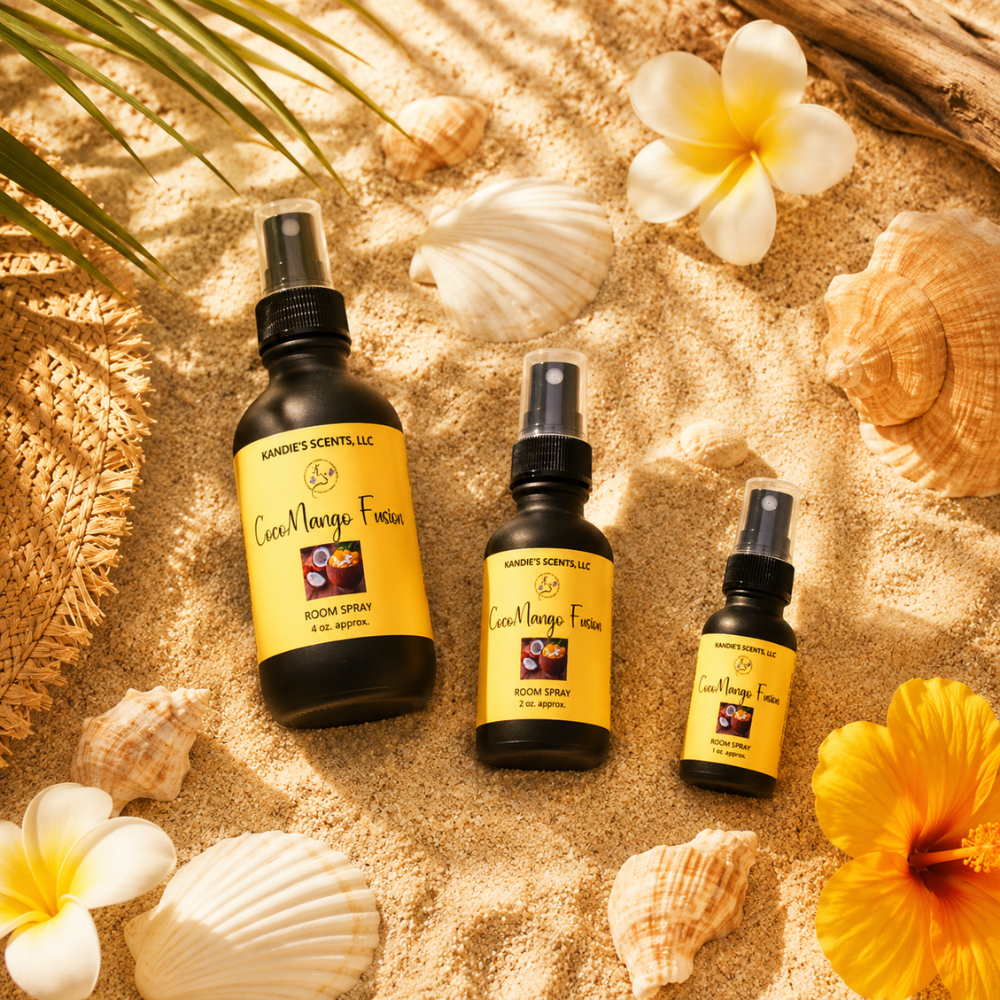Three black spray bottles with yellow labels on a sandy surface with flowers and shells.