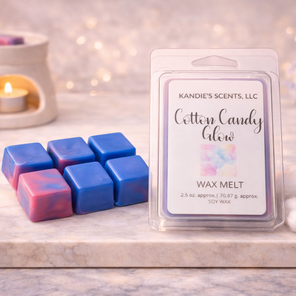 Kandie's Scents Cotton Candy Glow wax melts on a decorative surface with a blurred background.