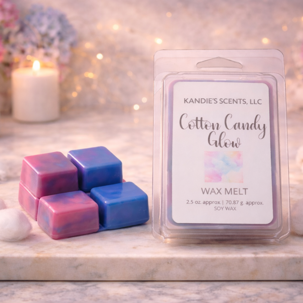Wax melts with packaging labeled 'Cotton Candy Glow' by Kandie's Scents, LLC on a decorative surface.
