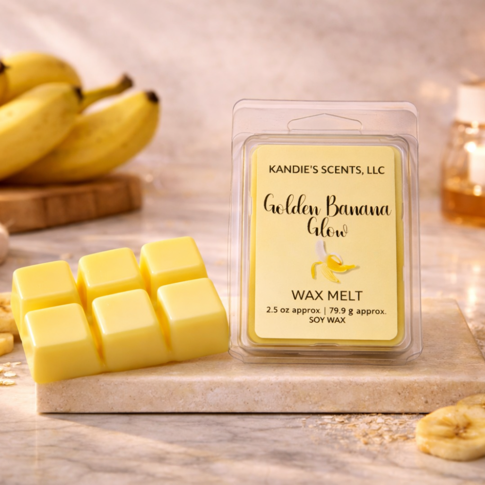 Kandie's Scents Golden Banana Glow wax melts on a marble surface with bananas in the background.