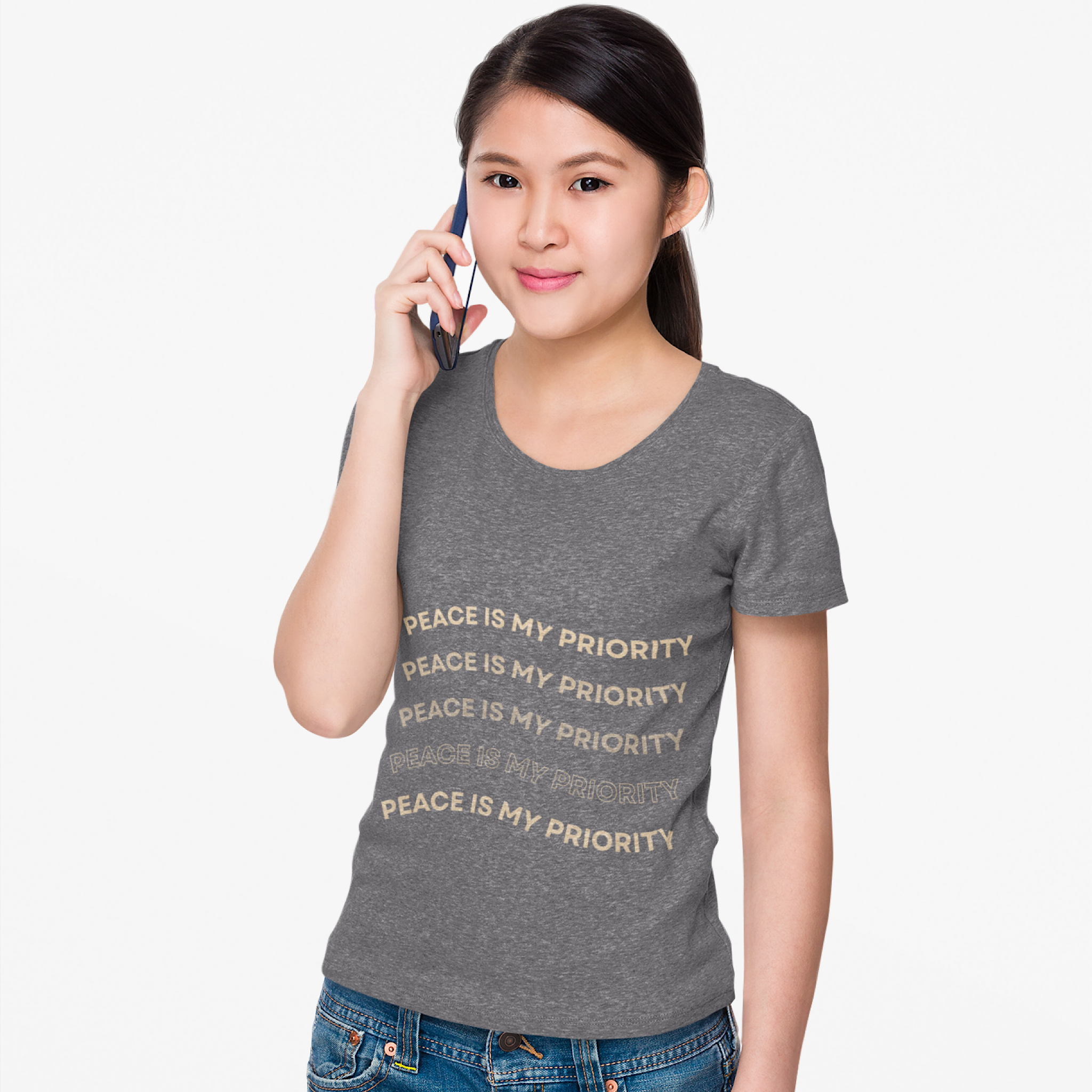 Woman wearing a gray t-shirt with 'Peace is my priority' text on a white background