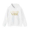 White hoodie with 'I AM THE VIBE' text in gold on a white background