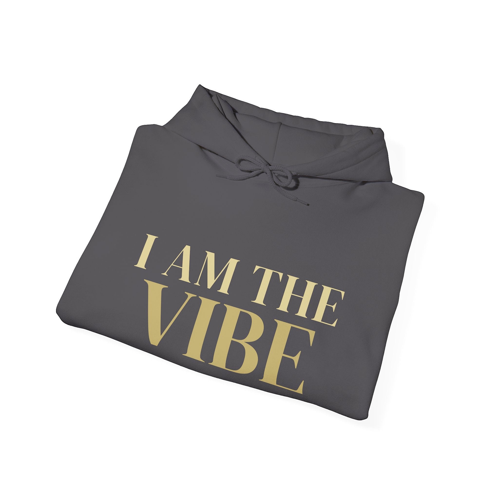 Folded gray hoodie with 'I AM THE VIBE' text in gold on a white background
