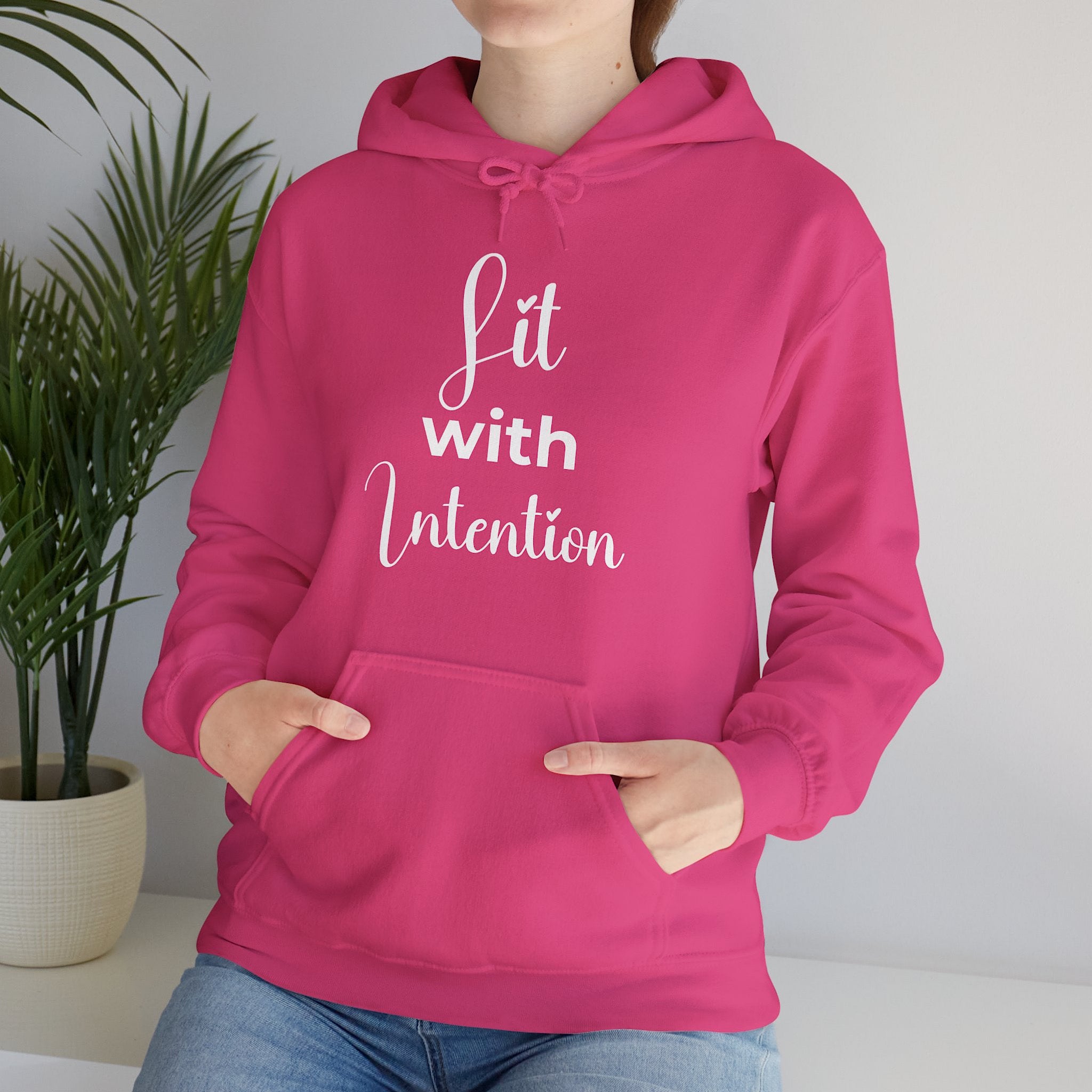 Pink hoodie with 'Lit with Intention' text on a white background