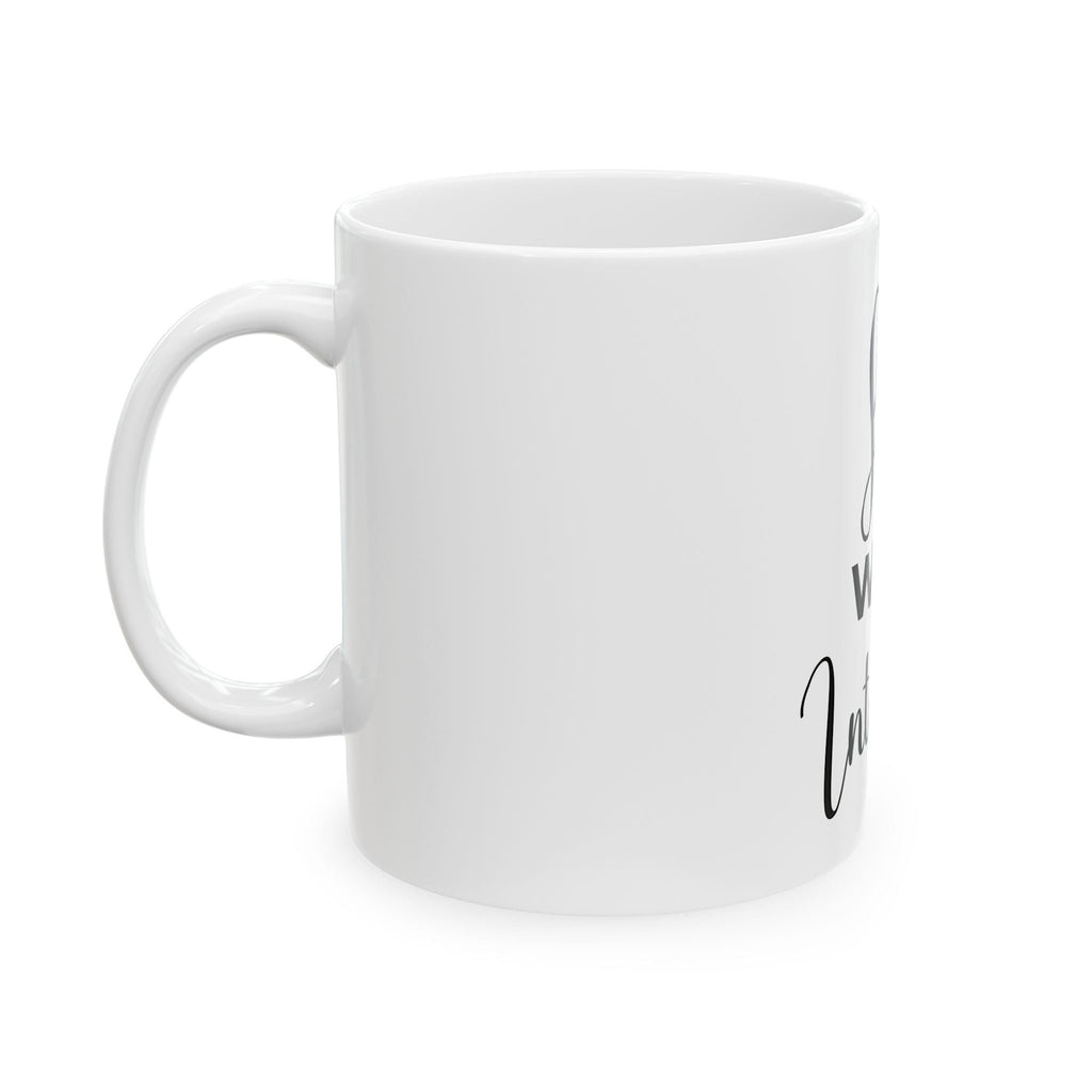 White mug with black text on a white background