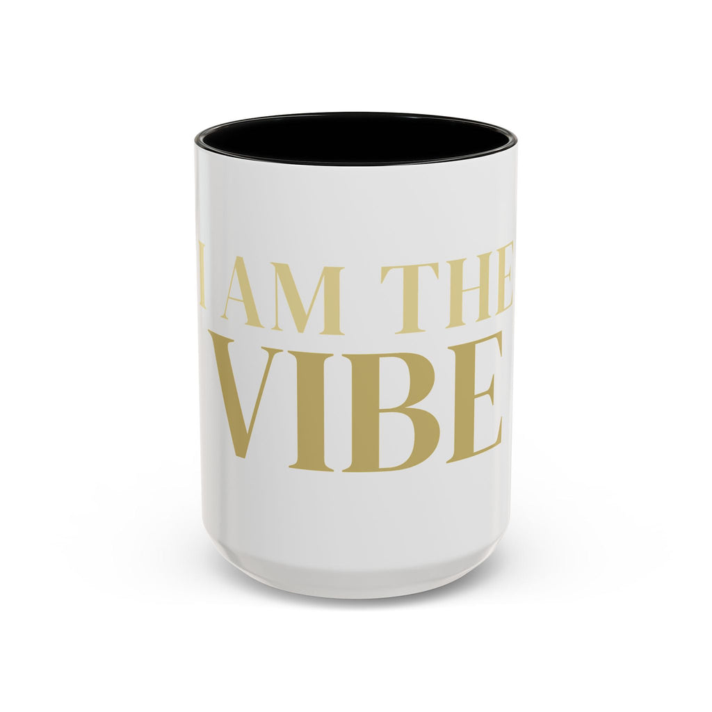 White mug with gold text 'I AM THE VIBE' on a white background