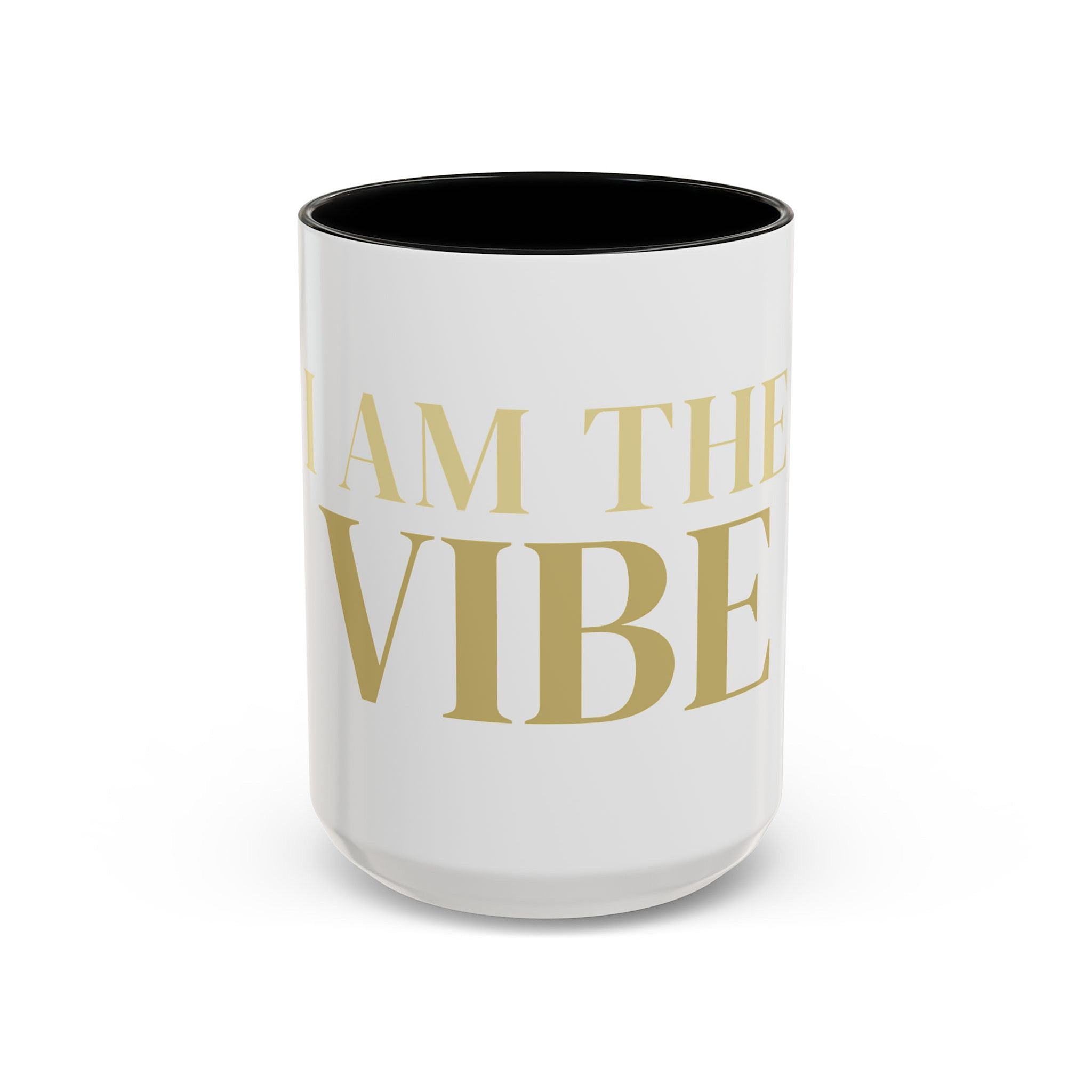 White mug with gold text 'I AM THE VIBE' on a white background
