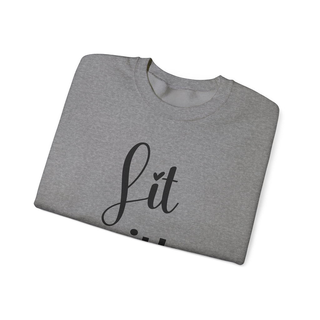 Folded gray sweatshirt with 'Lit with Intention' text on a white background