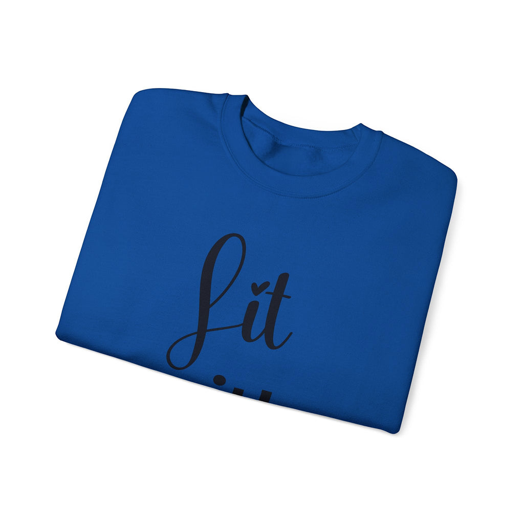 Folded blue sweatshirt with 'Lit' text on a white background