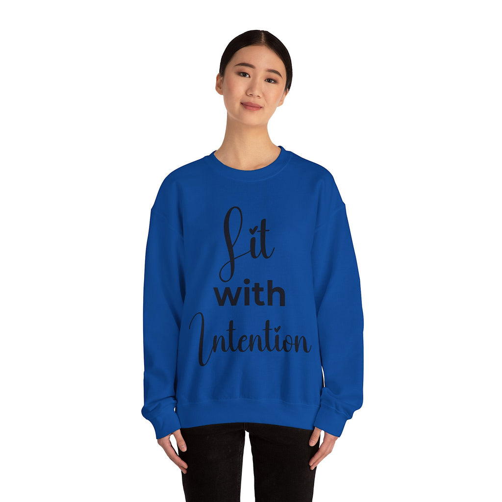 Person wearing a blue 'Lit with Intention' sweatshirt on a white background 