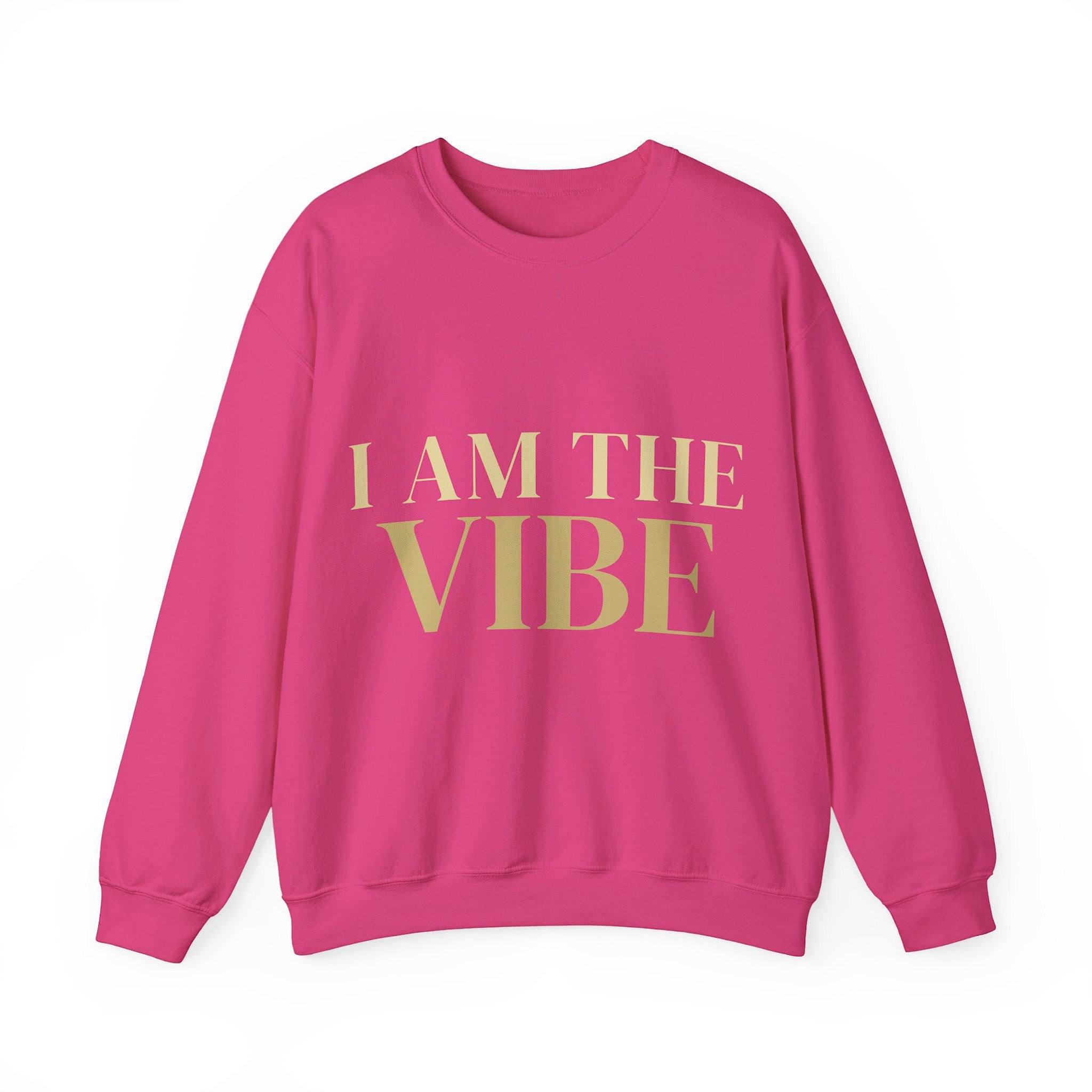 Pink sweatshirt with 'I AM THE VIBE' text on a white background