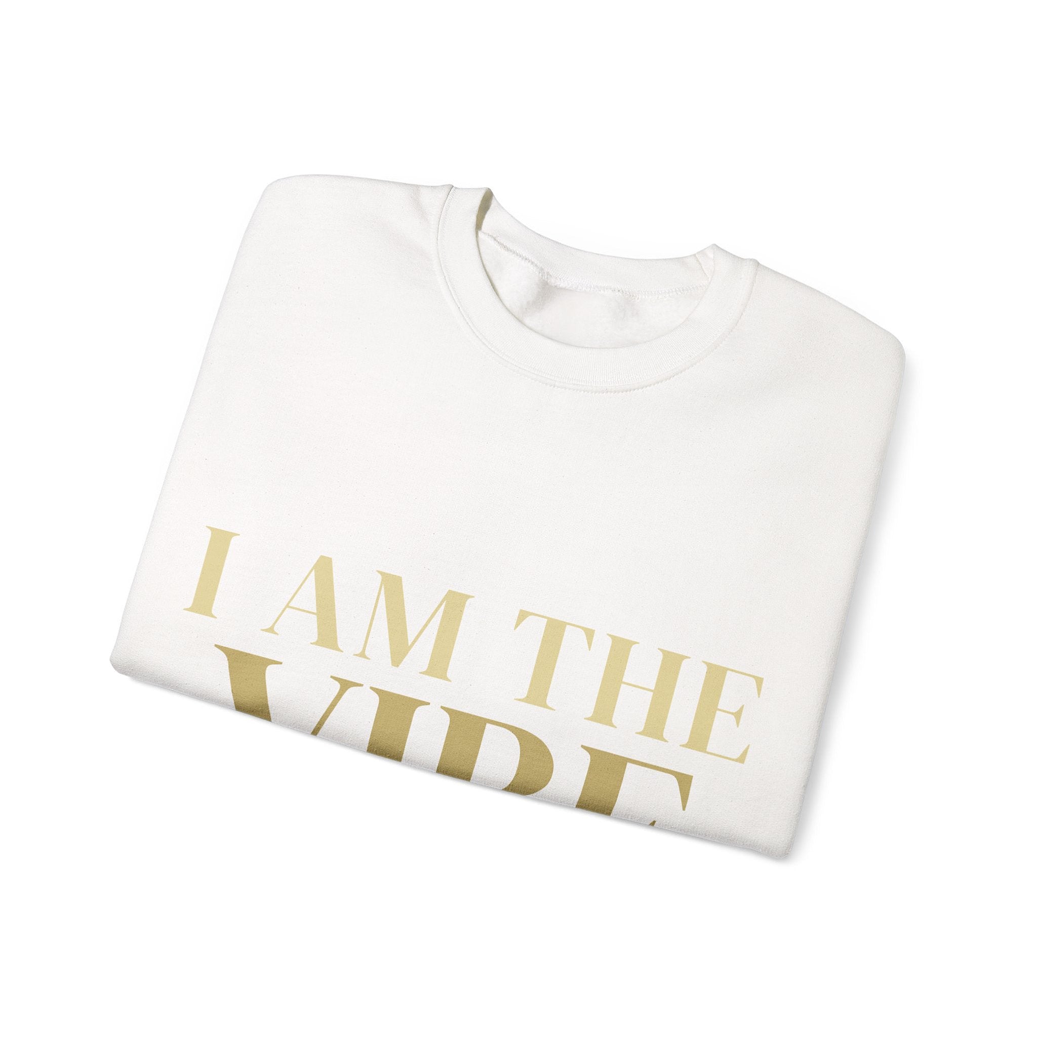 White sweatshirt with 'I AM THE VIBE' text in gold on a white background