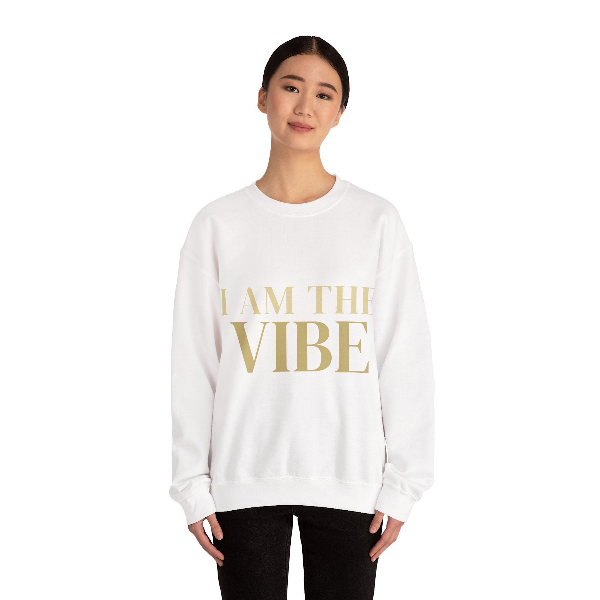 Person wearing a white sweatshirt with 'I AM THE VIBE' text on a white background