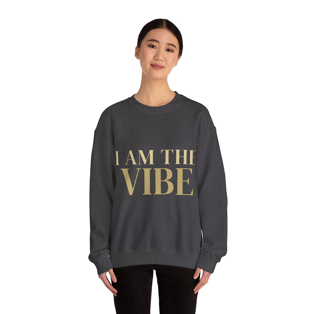 Person wearing a dark gray sweatshirt with 'I AM THE VIBE' design on a white background