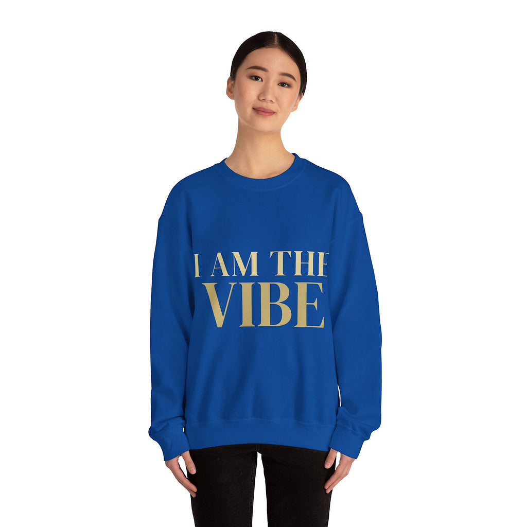 Person wearing a blue sweatshirt with 'I AM THE VIBE' text on a white background