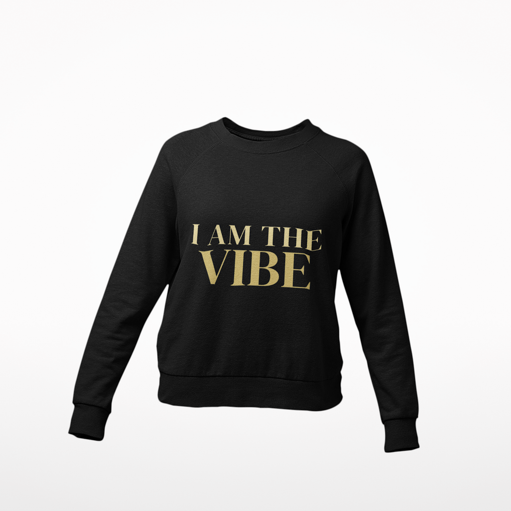 Black sweatshirt with 'I AM THE VIBE' text in gold on a white background