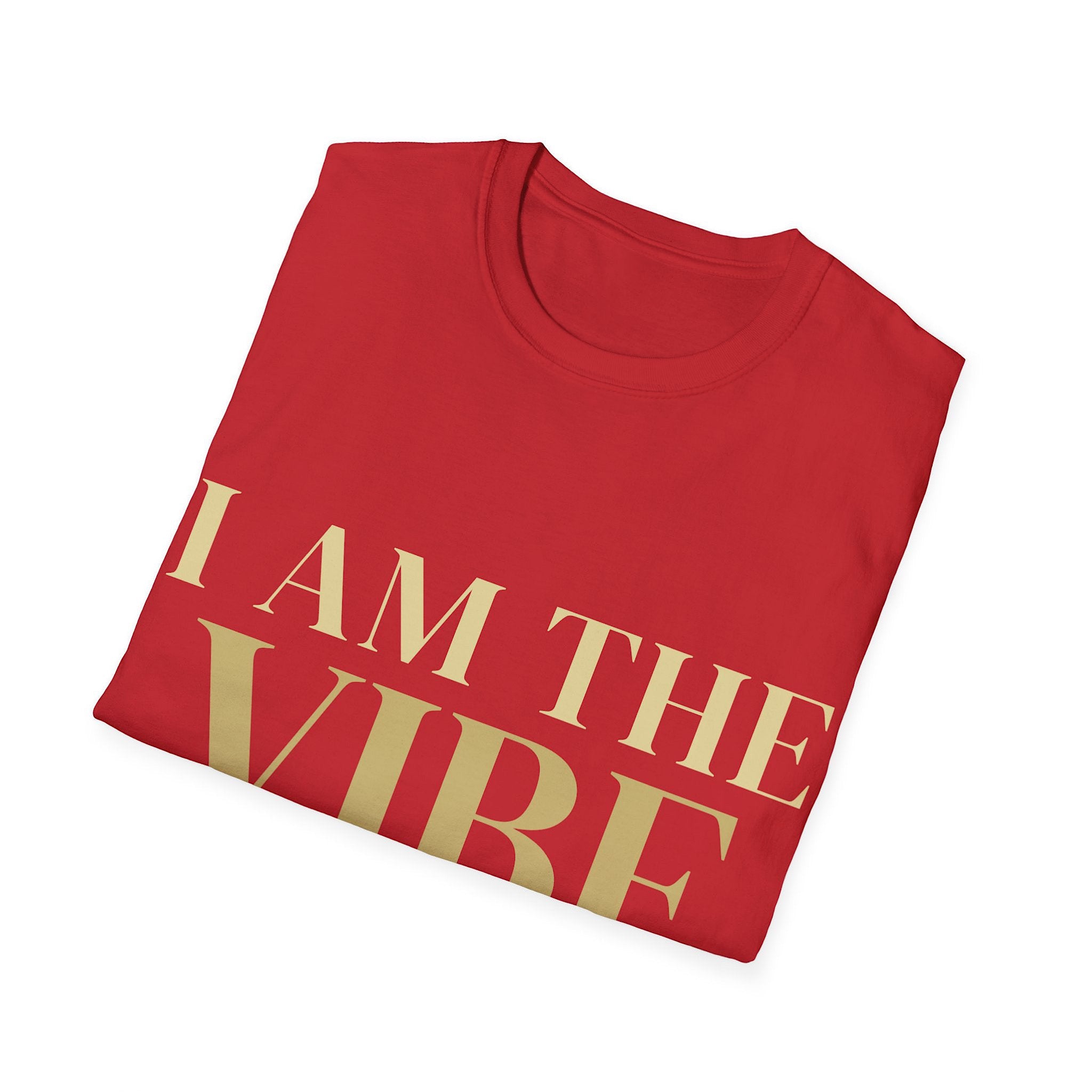 Folded red t-shirt with 'I AM THE VIBE' text in gold on a white background