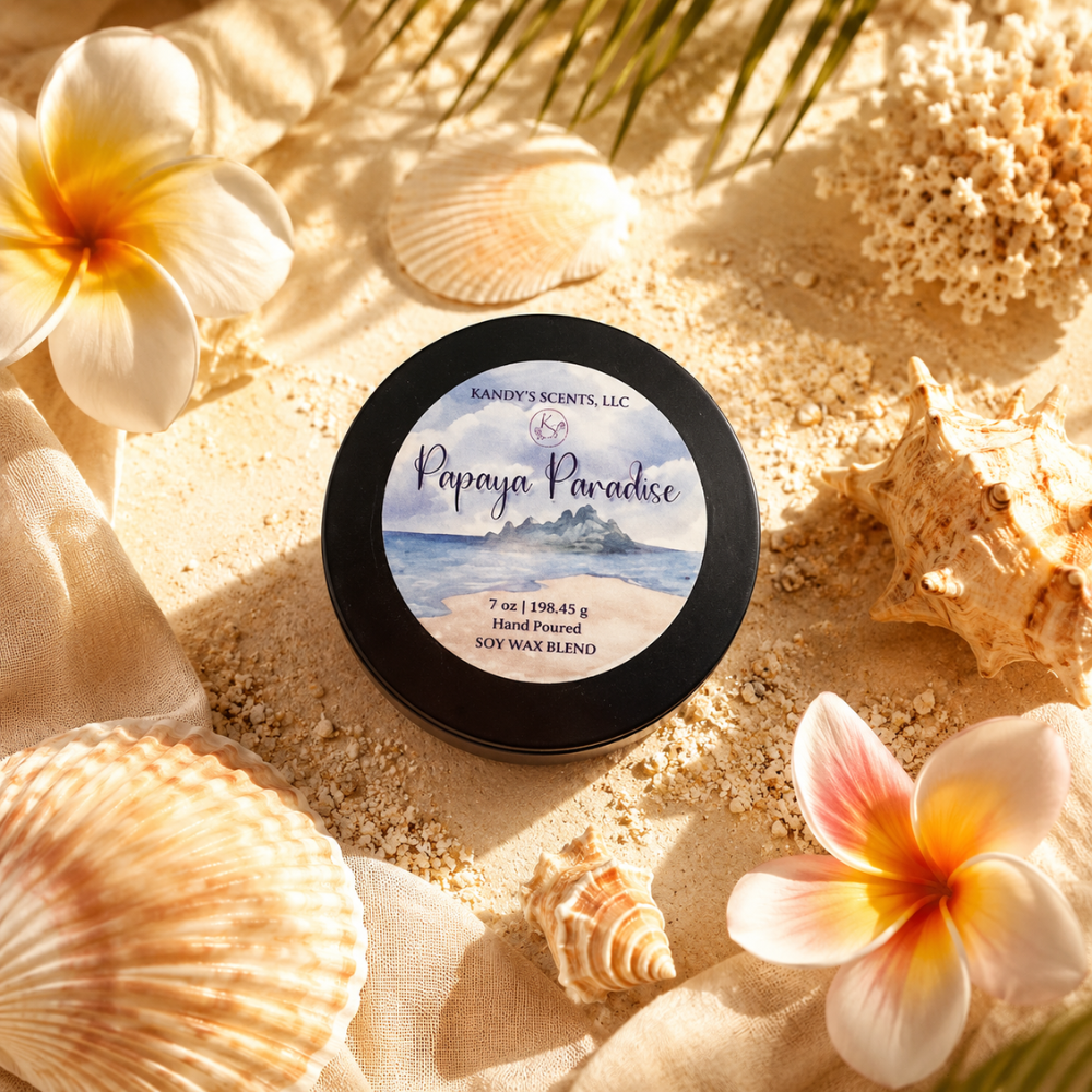 Jar of 'Papaya Paradise' wax blend surrounded by seashells and flowers on sand