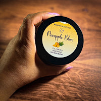 Matte black tin candle with bright tropical spa fragrance