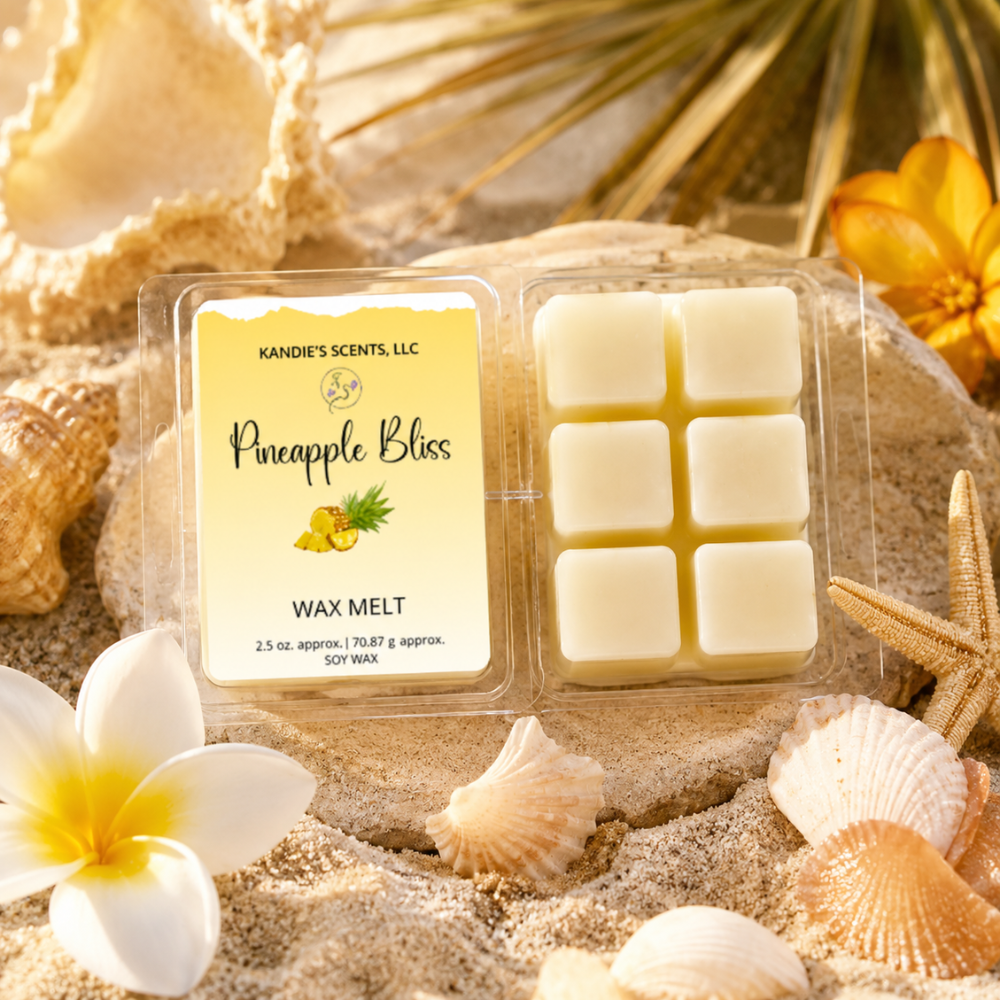 Packaged wax melts with 'Pineapple Bliss' label on a sandy background with shells and flowers.