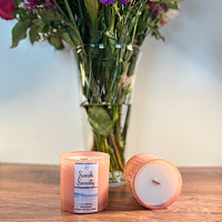 Pink glass jar candle with coconut soy wax and calming coastal fragranc