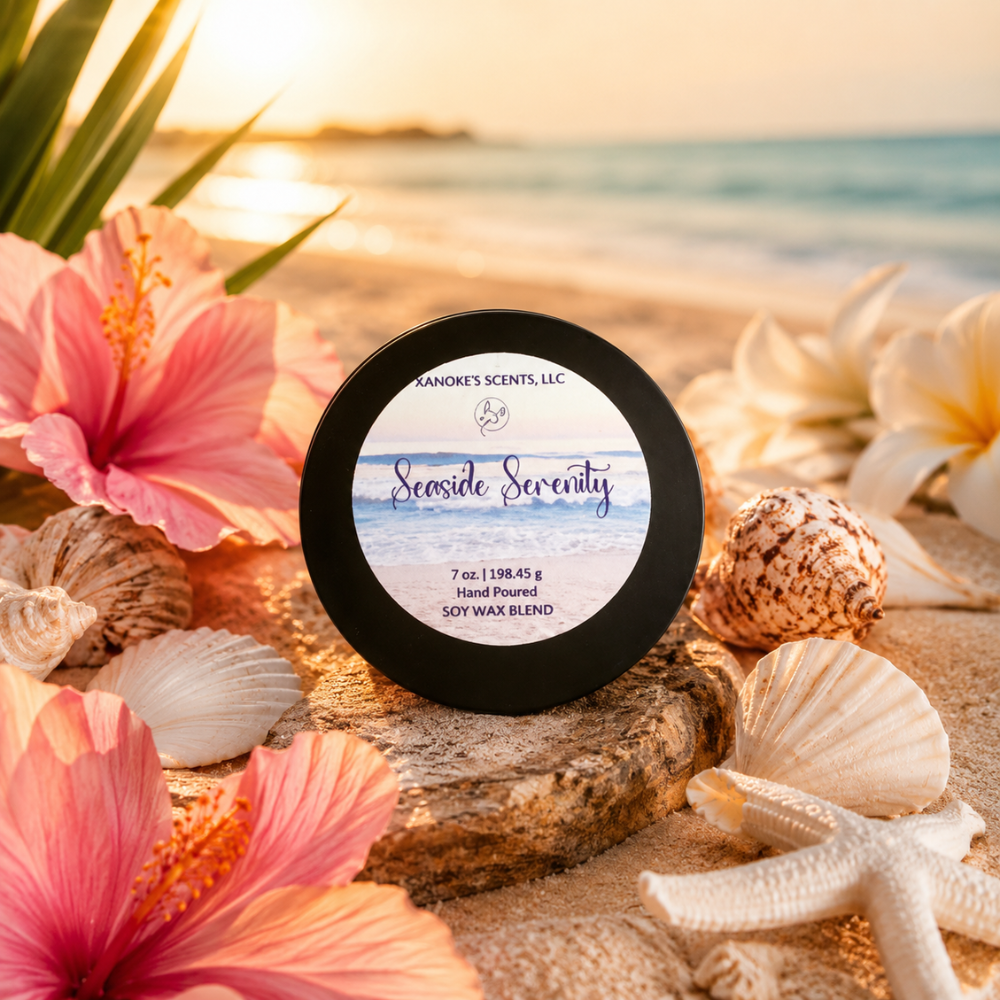 Jar of 'Seaside Serenity' candle with beach-themed packaging on a sandy background with flowers and shells.