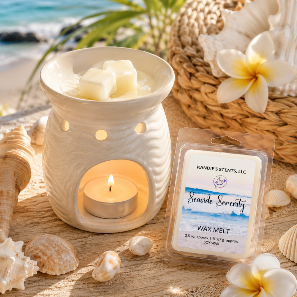 Wax warmer with lit candle and Seaside Serenity wax melt packaging on a beach-themed setting with shells and flowers.