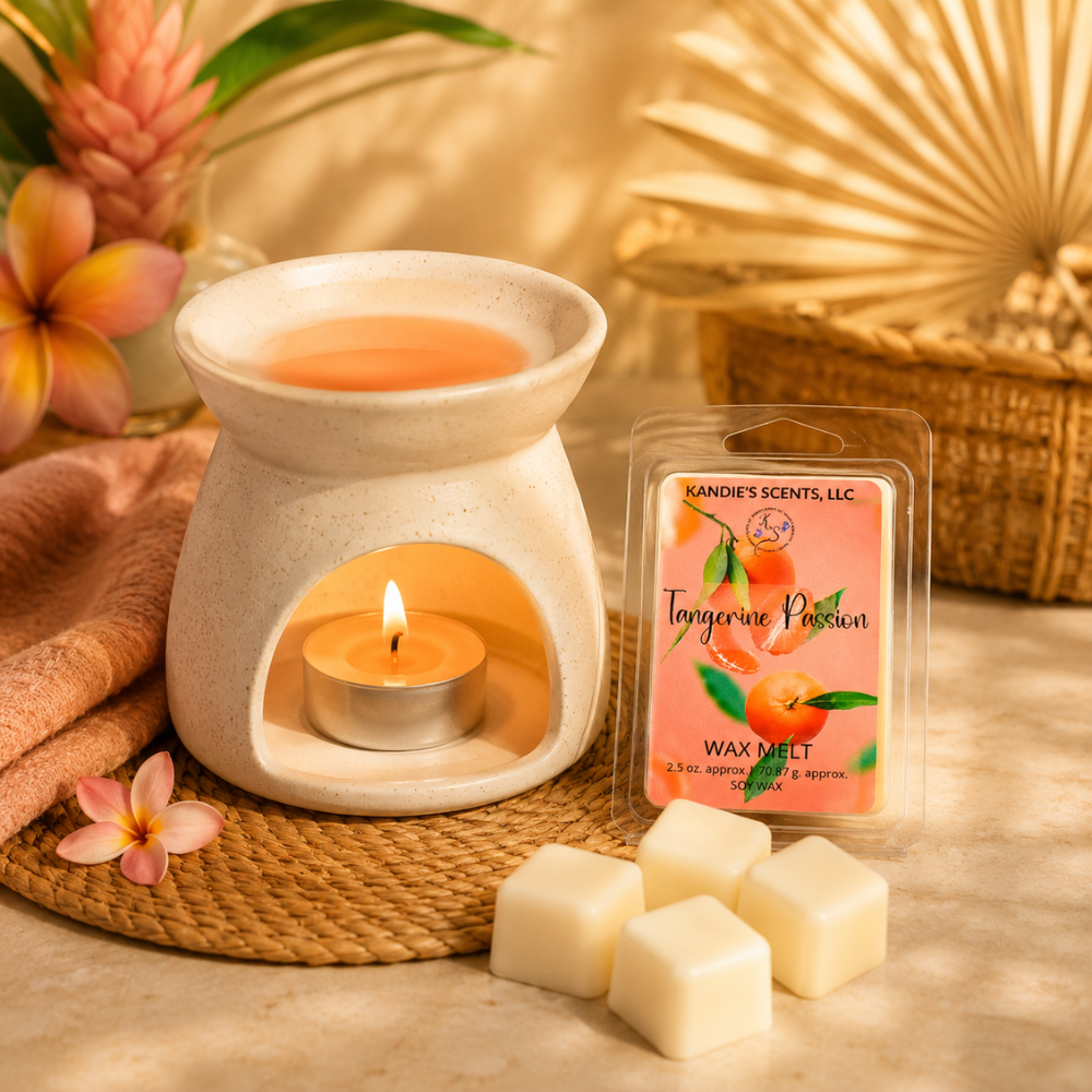 Wax melt warmer with a lit tea light candle, Kandie's Scents wax melt package, and wax melts on a decorative mat.