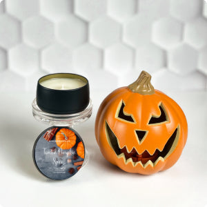 Matte black travel tin candle with cozy fall fragrance