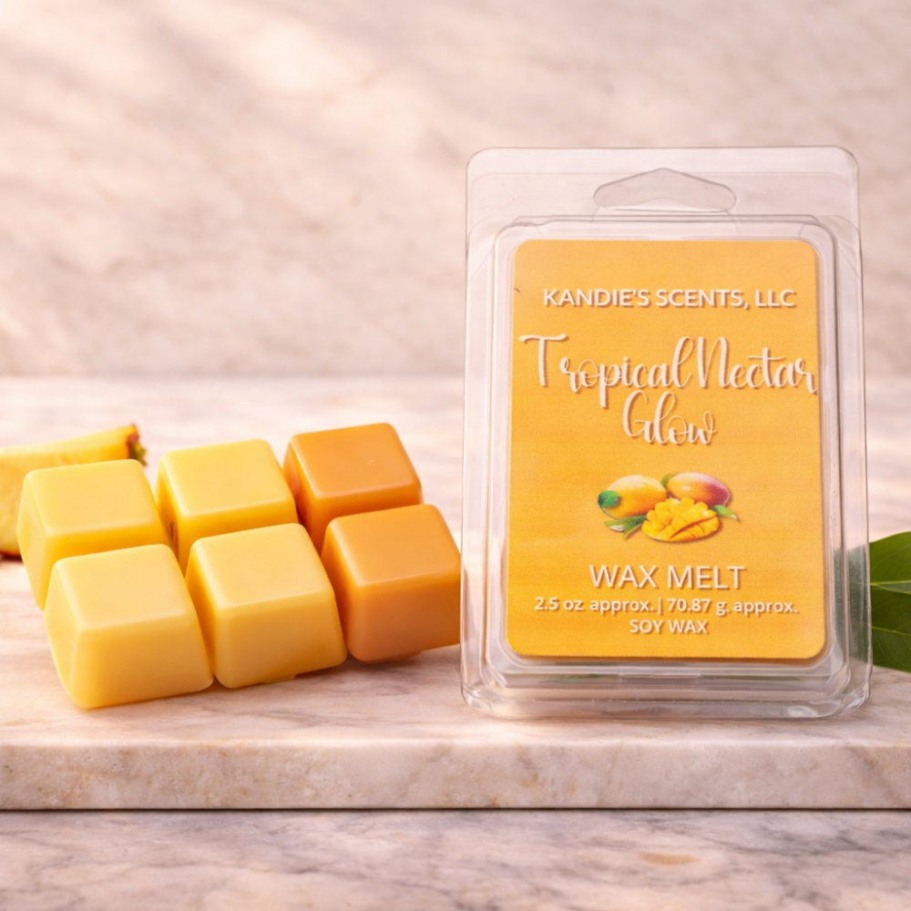 Kandie's Scents Tropical Nectar Glow wax melt packaging with wax cubes on a wooden surface.