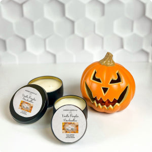 Matte black tin candles with creamy fall fragrance