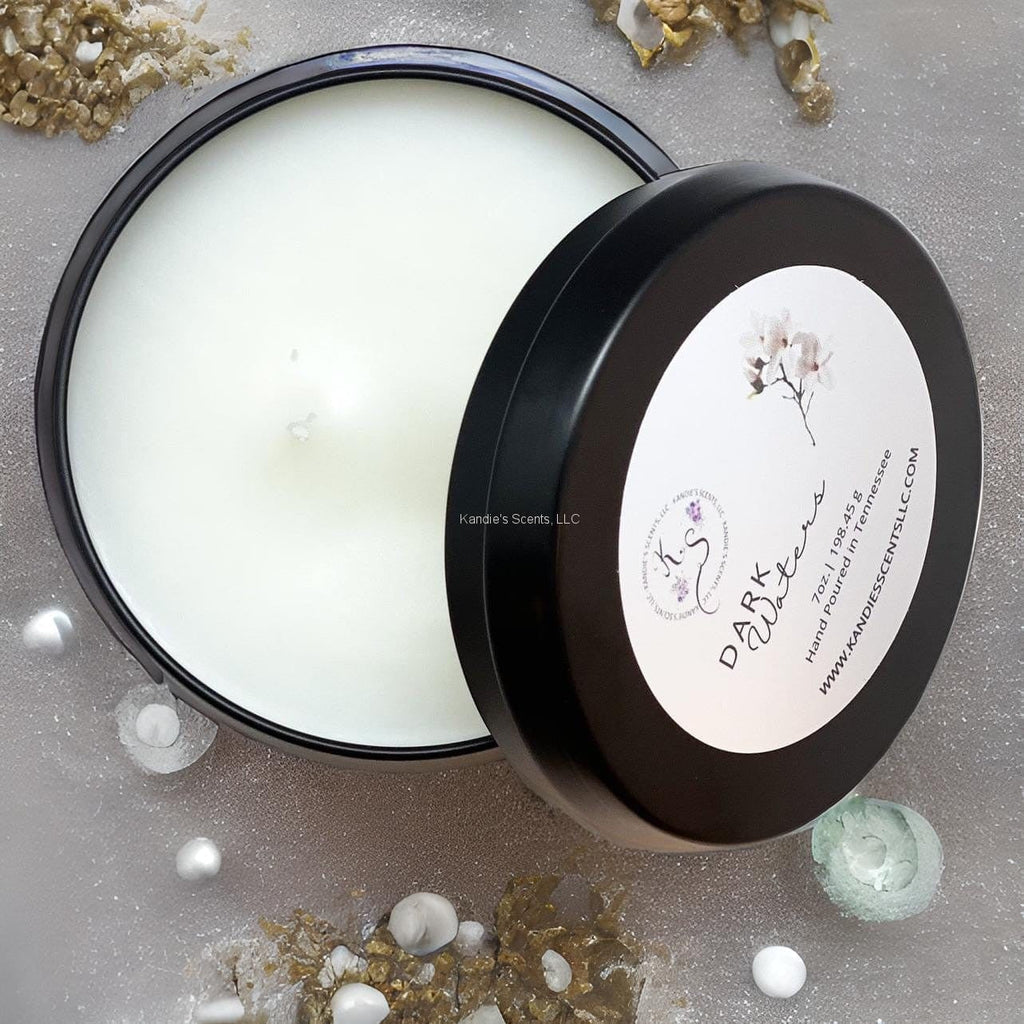 Matte black travel tin candle with ocean-inspired musk scent