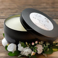Soy blend travel tin candle with earthy floral fragrance