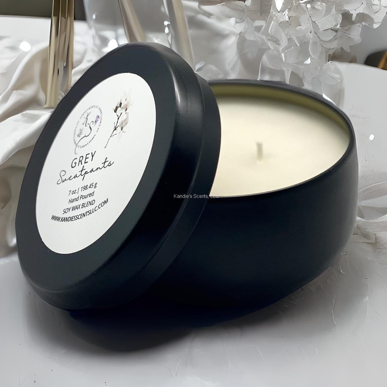 Matte black soy blend tin candle with mahogany and lavender