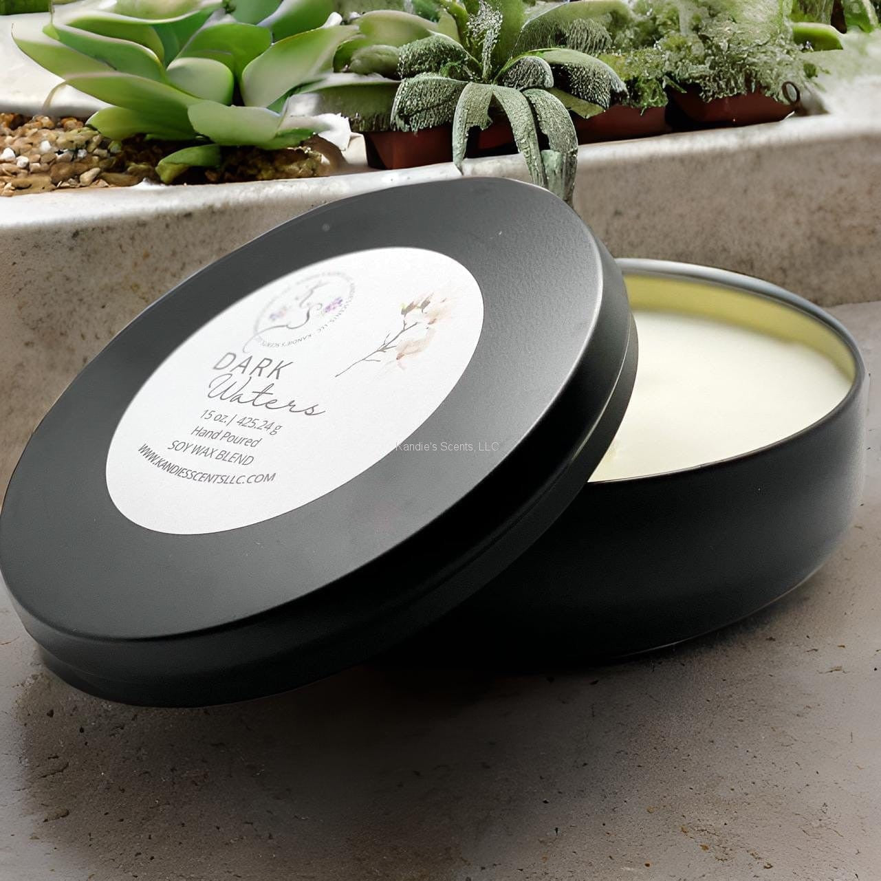 Dark Waters candle tin with sea salt and amber notes