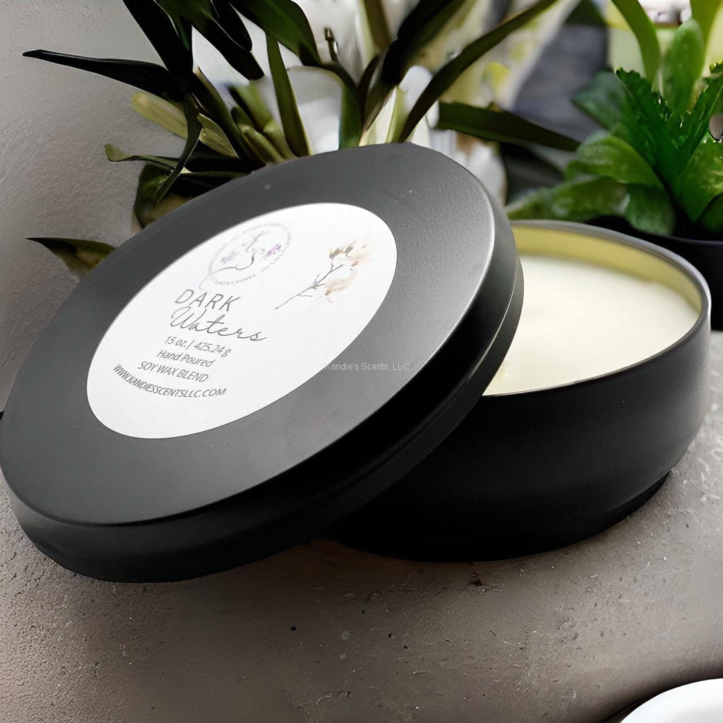 Matte black travel tin candle with ocean-inspired musk scent