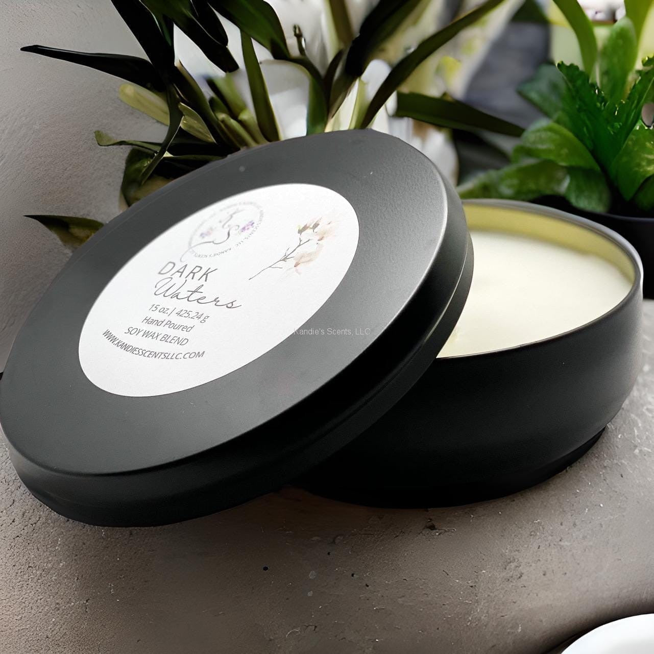 Matte black travel tin candle with ocean-inspired musk scent