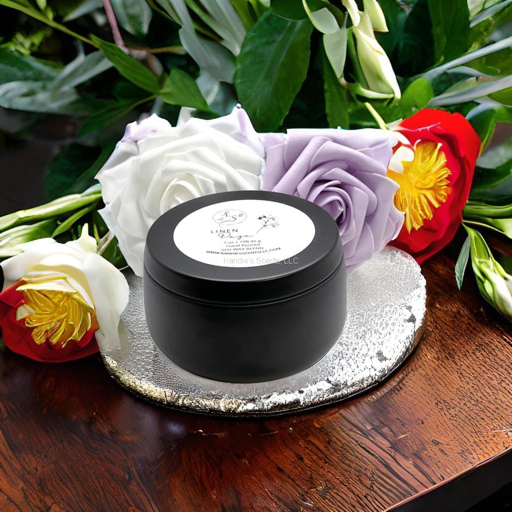 Matte black soy candle tin with peach and cotton notes