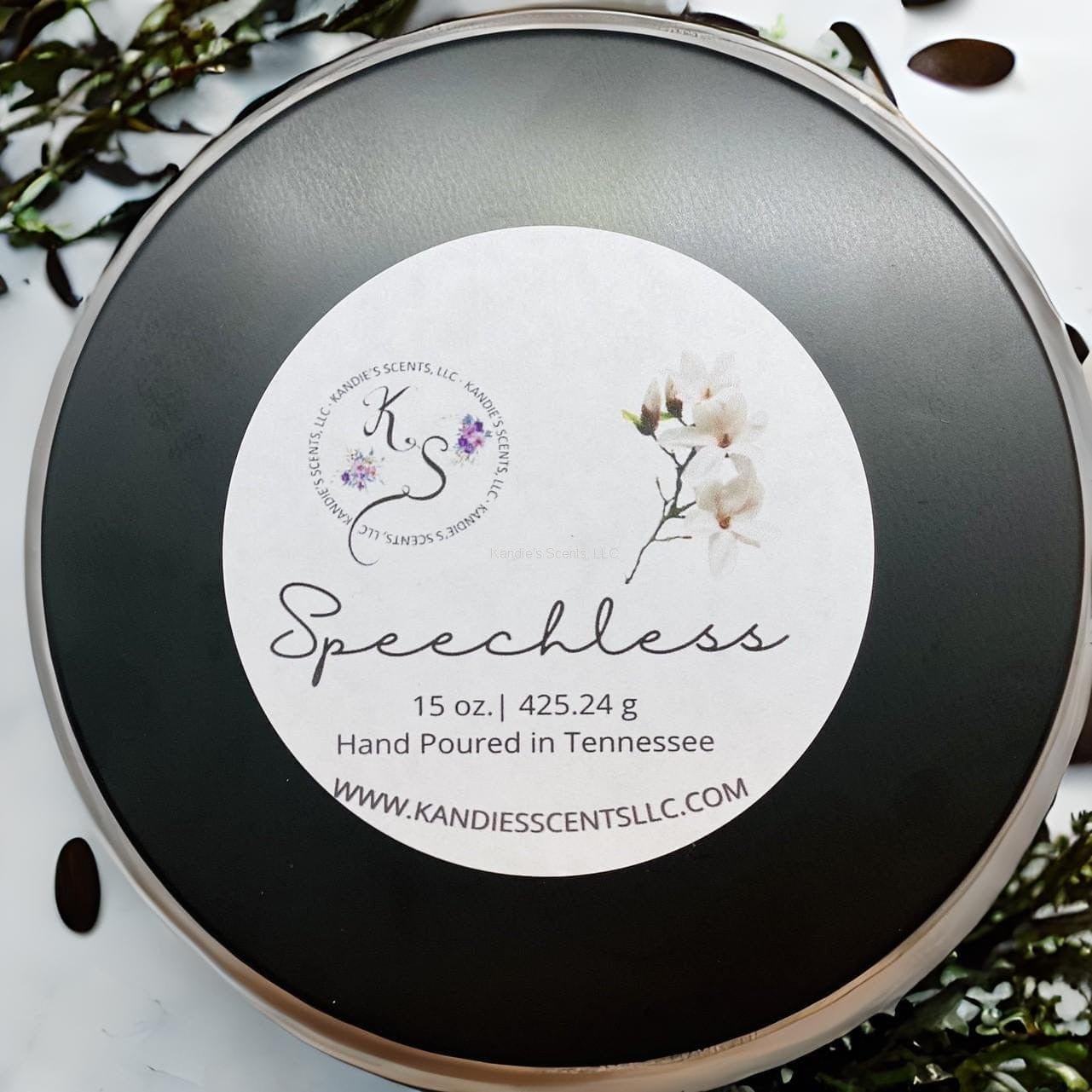 Matte black soy blend candle tin with cozy warm fragrance