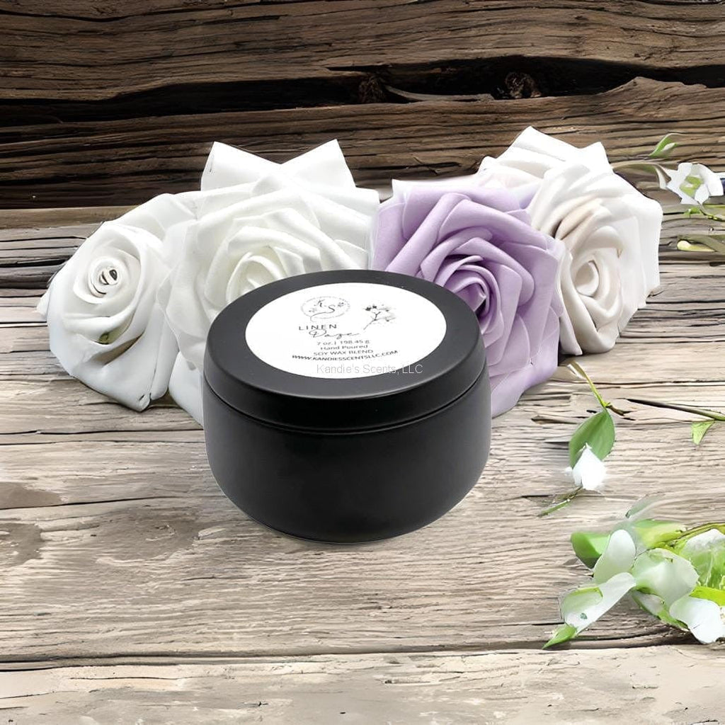 Matte black soy candle tin with peach and cotton notes