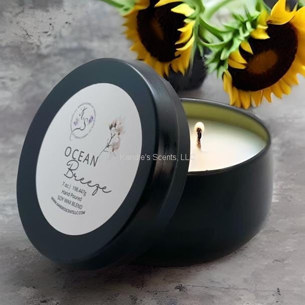 Travel-size candle tin with coastal sea air notes