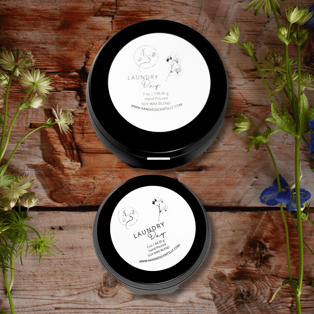Matte black soy candle tins with clean laundry fragrance