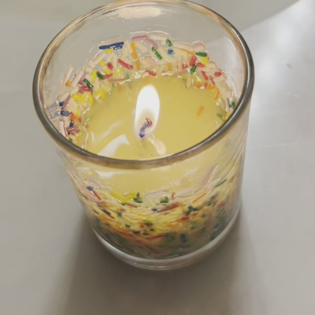 Fun celebration soy wax candle in glass jar with bamboo lid